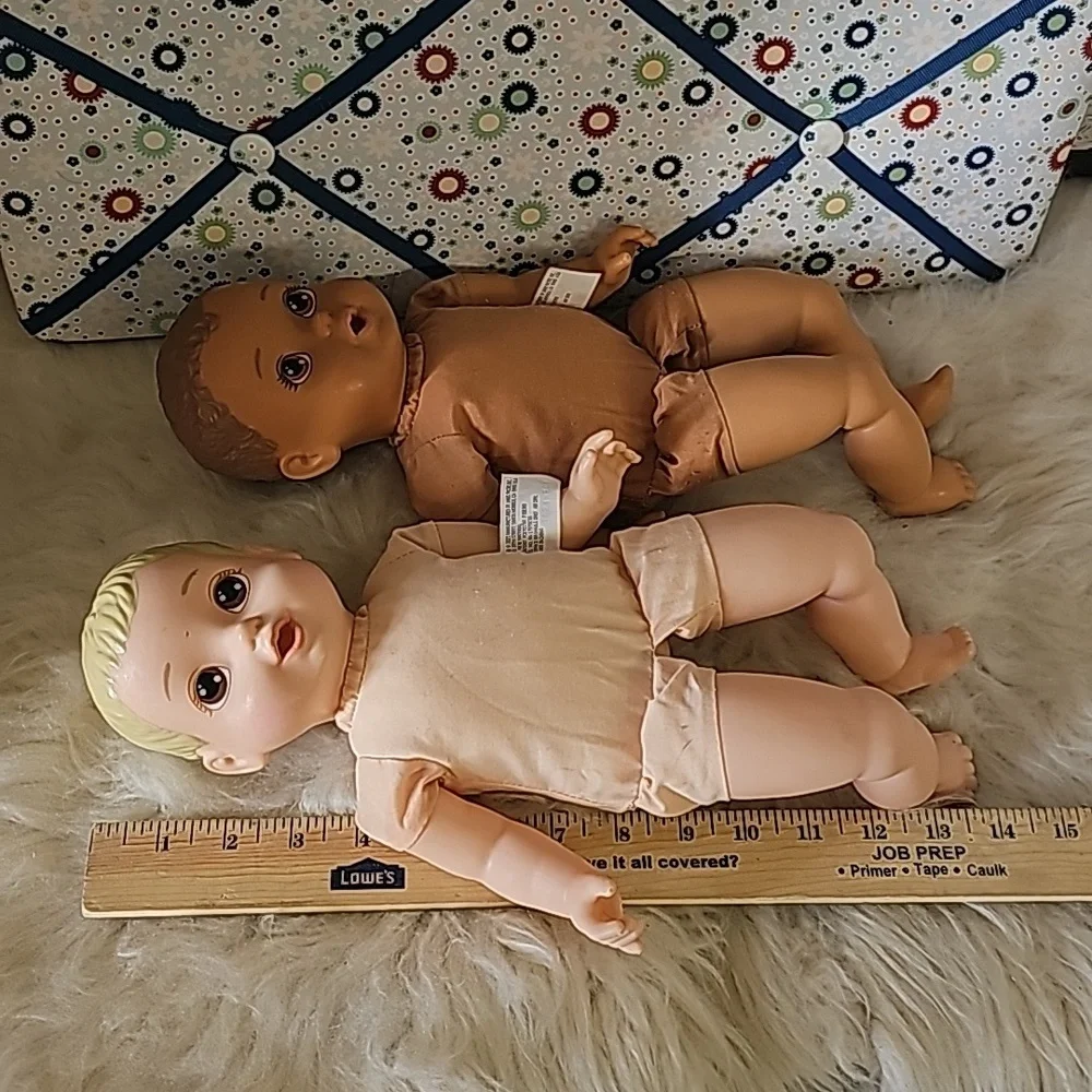 2 cute soft body dolls blonde hair and dark